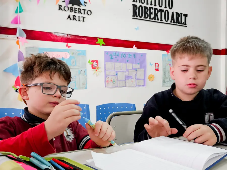Students writing in the classroom
